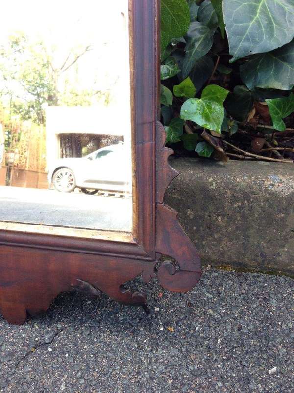 A Georgian mahogany mirror with an eagle