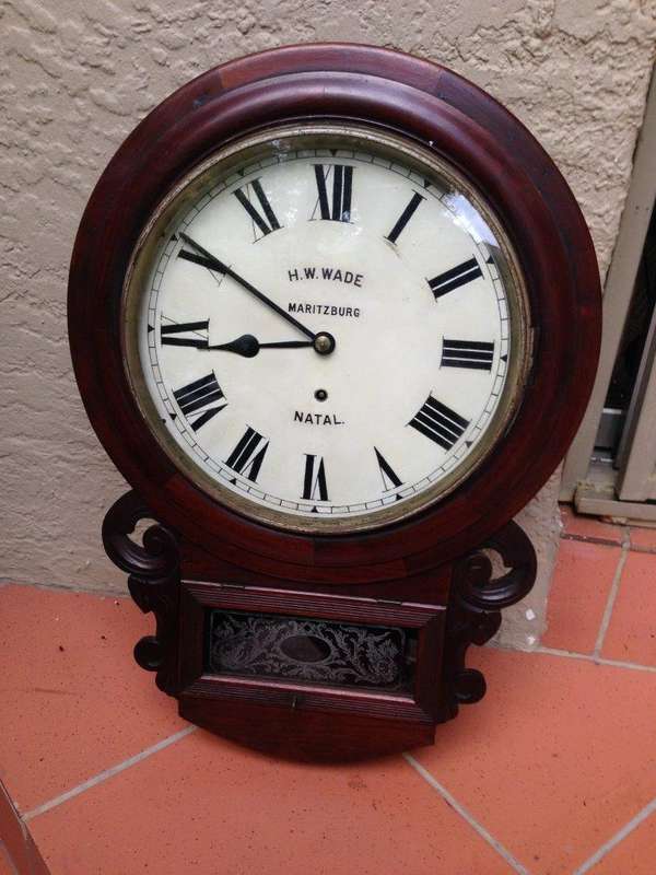 A 19thC mahogany cased Station / Office Wall Clock, with pendulum and key, signed H.W. Wade