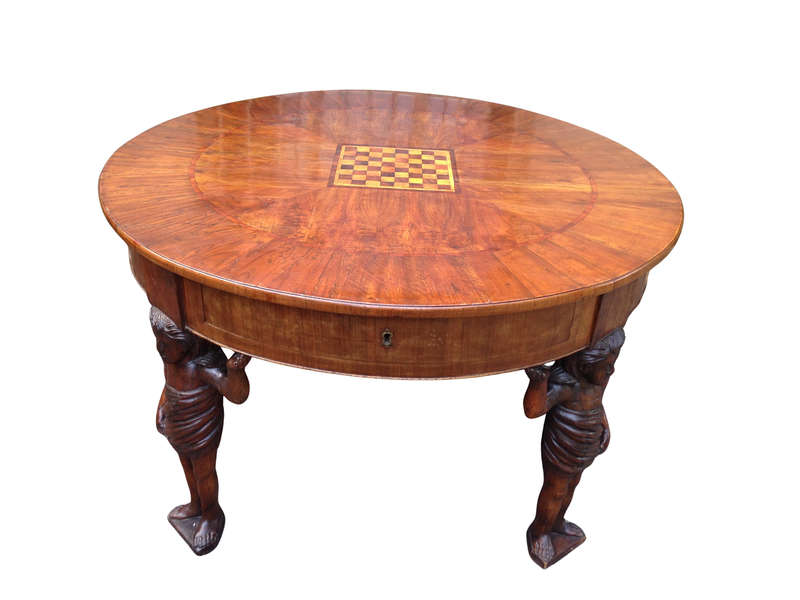 An English Walnut and Rosewood Circular Table With An Inlaid Chess Board And Two Drawers. Circa 1...