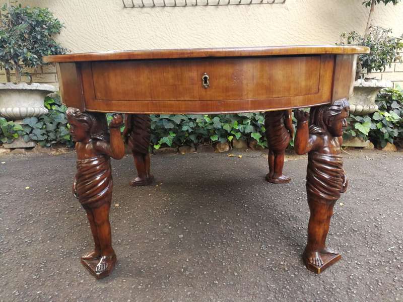 An English Walnut and Rosewood Circular Table With An Inlaid Chess Board And Two Drawers. Circa 1...