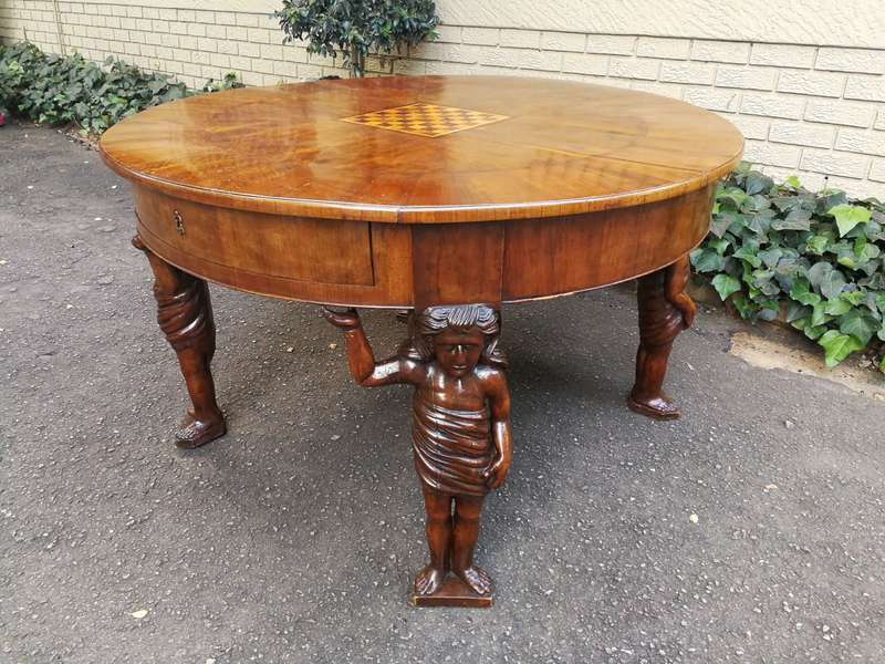 An English Walnut and Rosewood Circular Table With An Inlaid Chess Board And Two Drawers. Circa 1...