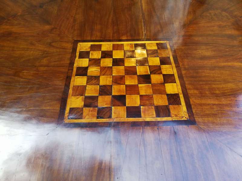 An English Walnut and Rosewood Circular Table With An Inlaid Chess Board And Two Drawers. Circa 1...