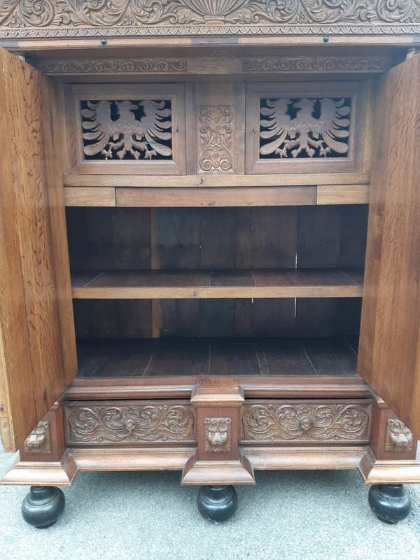 An Early 19th Century Renaissance Ornately Carved Oak Kussenkast On Bun Feet (Useful for TV or st...