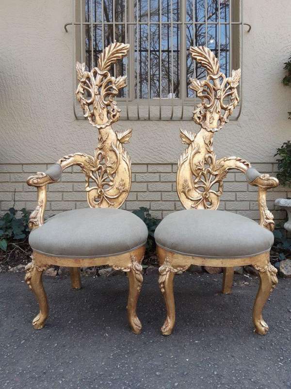 A Pair of Baroque Style Carved and Hand Gilded High Back Throne Chairs (upholstered in linen upho...