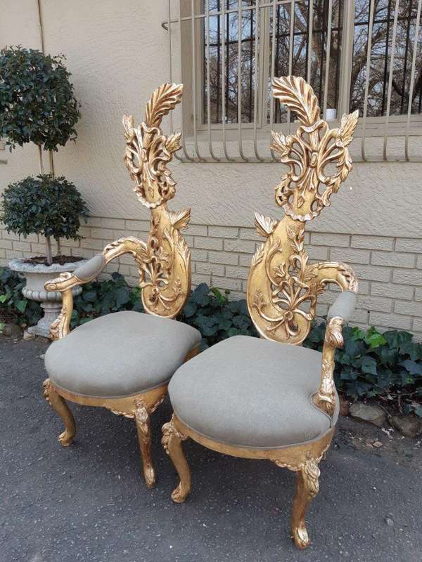 A Pair of Baroque Style Carved and Hand Gilded High Back Throne Chairs (upholstered in linen upho...