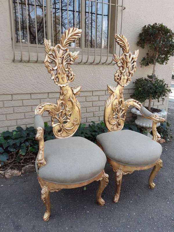 A Pair of Baroque Style Carved and Hand Gilded High Back Throne Chairs (upholstered in linen upho...