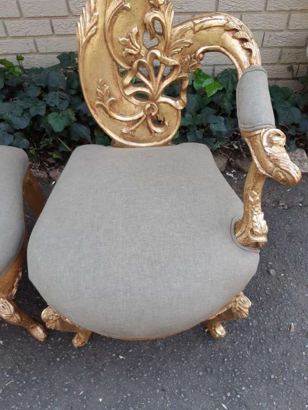 A Pair of Baroque Style Carved and Hand Gilded High Back Throne Chairs (upholstered in linen upho...