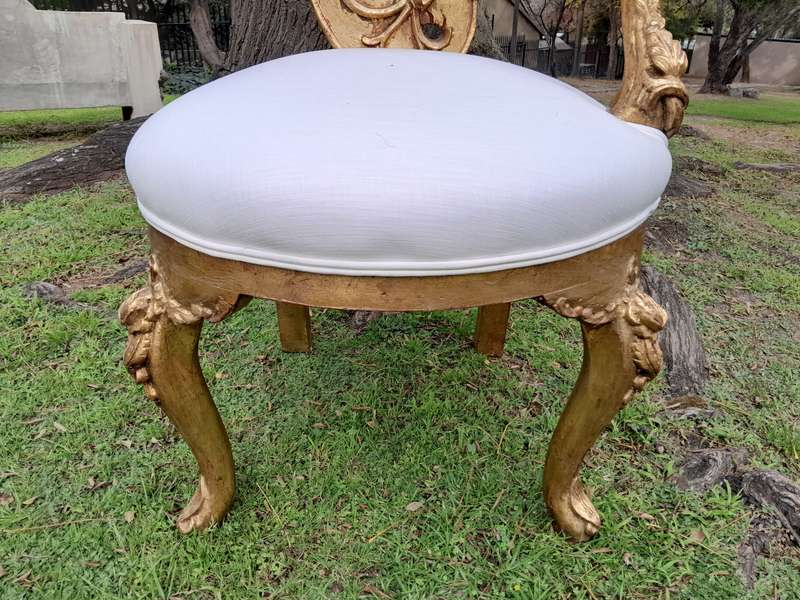 A Pair of Baroque Style Carved and Hand Gilded High Back Throne Chairs (upholstered in white)