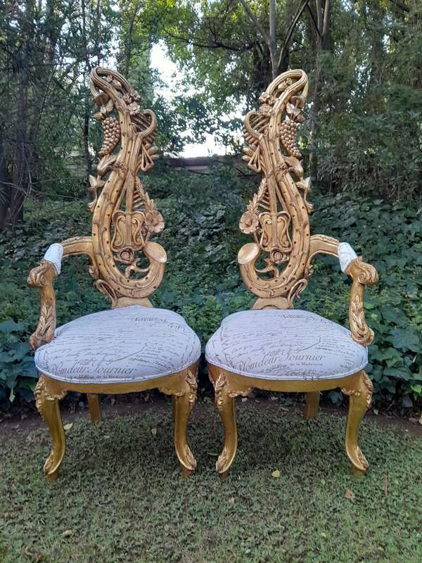 A Pair of Baroque Style Carved and Hand Gilded High Back Throne Chairs (upholstered linen upholst...