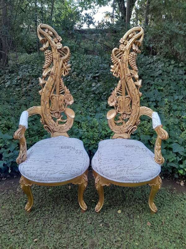 A Pair of Baroque Style Carved and Hand Gilded High Back Throne Chairs (upholstered linen upholst...