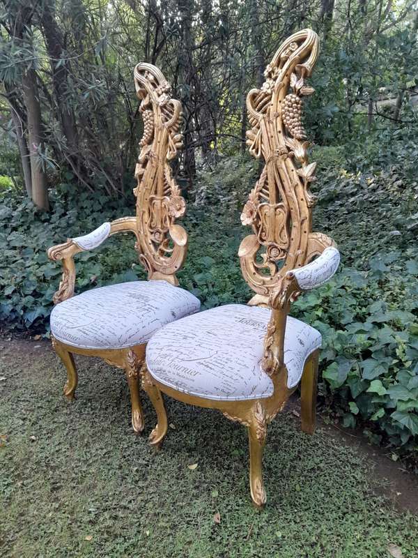 A Pair of Baroque Style Carved and Hand Gilded High Back Throne Chairs (upholstered linen upholst...