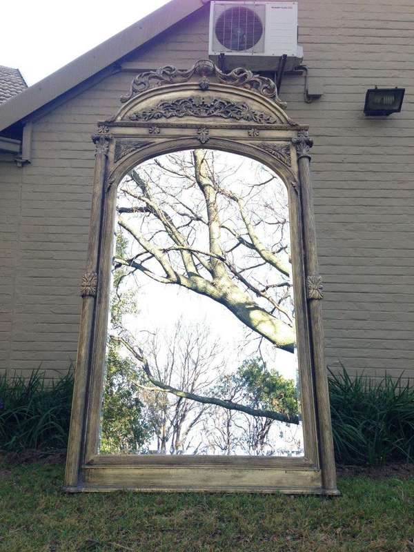 An Ornate Carved & Bevelled Mirror