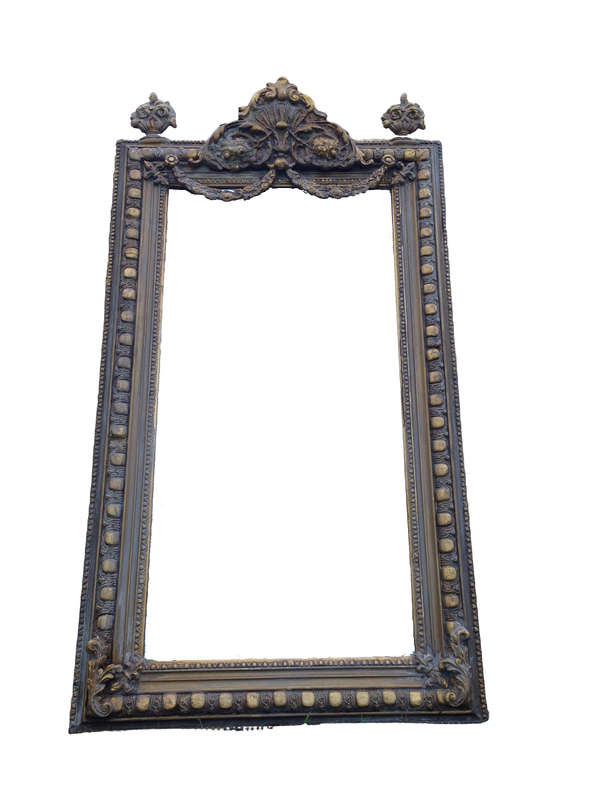 An Ornate Carved Painted Mirror