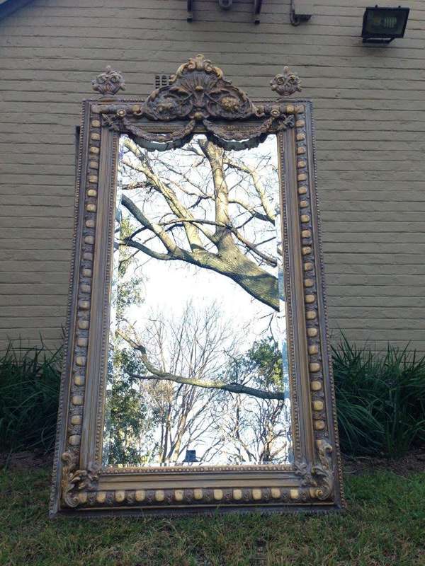 An Ornate Carved Painted Mirror
