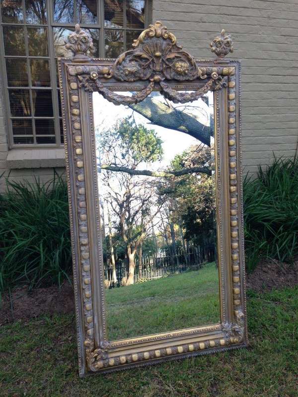 An Ornate Carved Painted Mirror
