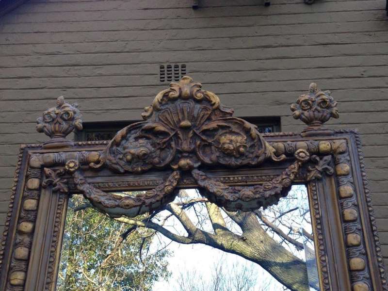 An Ornate Carved Painted Mirror