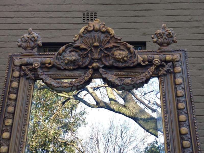 An Ornate Carved Painted Mirror