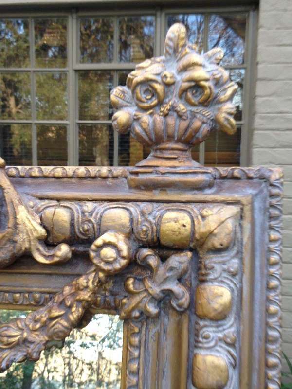 An Ornate Carved Painted Mirror