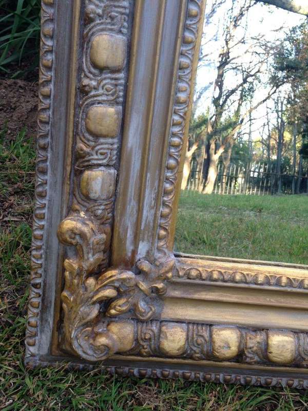 An Ornate Carved Painted Mirror