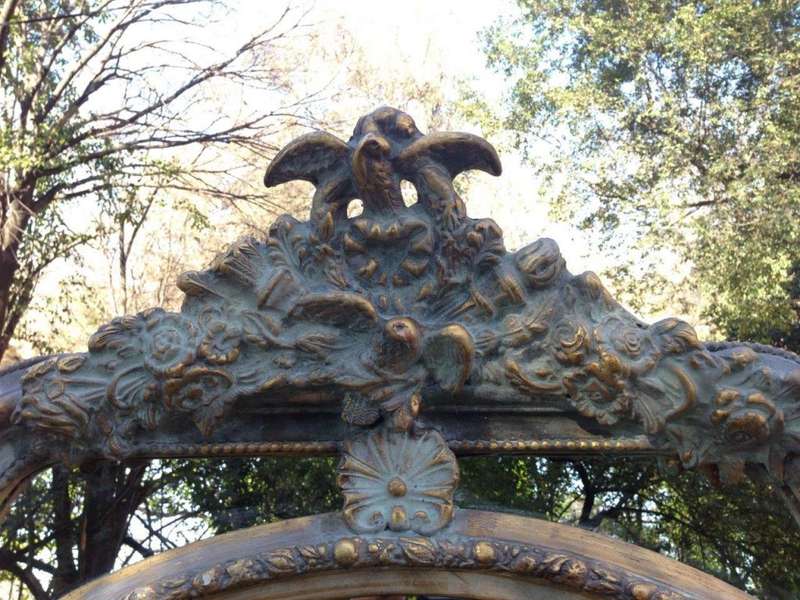 A French Ornate carved painted mirror with a bevelled centre section