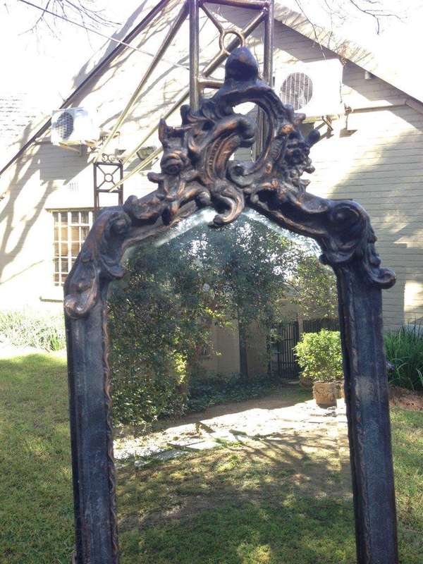 An Ornate Carved Gilded Mirror in the Rococo Style