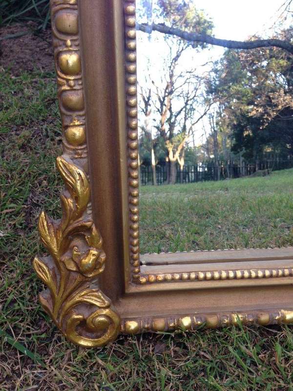 An Ornate Carved Arched Bevelled Mirror