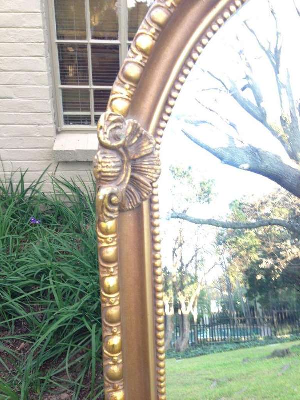 An Ornate Carved Arched Bevelled Mirror