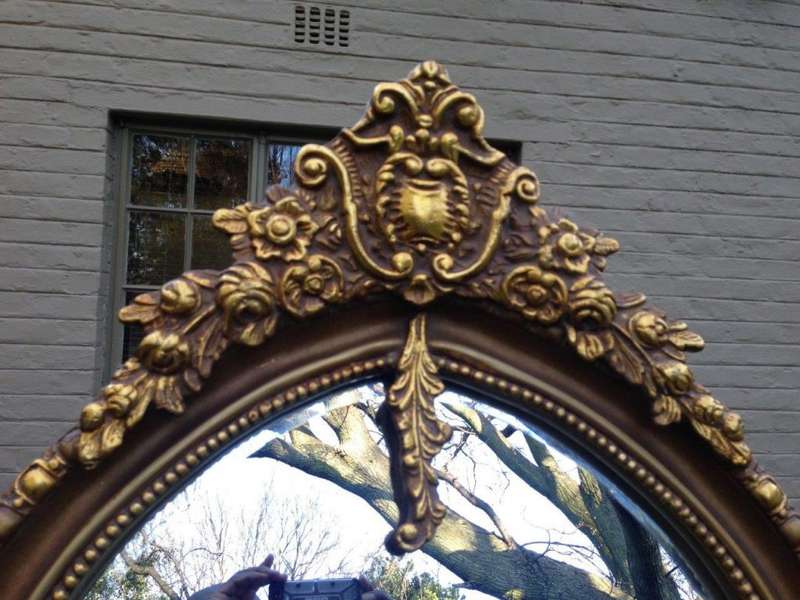 An Ornate Carved Arched Bevelled Mirror