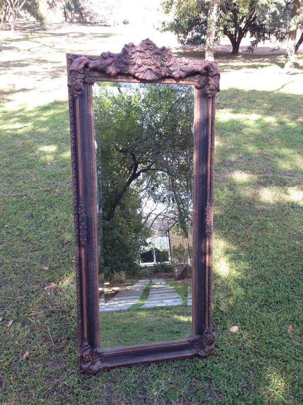 An Ornate Carved Bevelled Mirror
