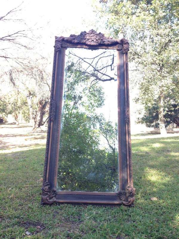 An Ornate Carved Bevelled Mirror