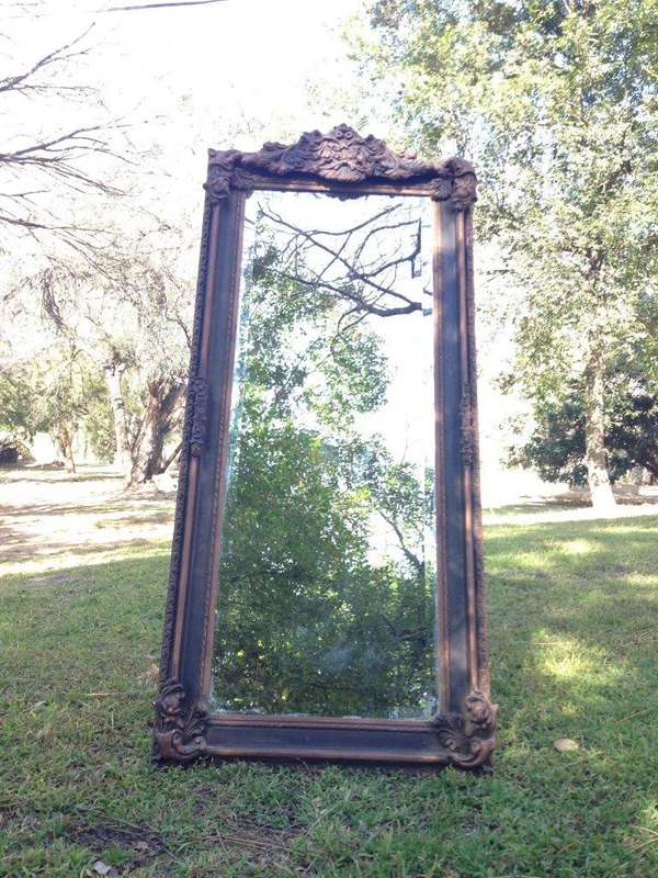 An Ornate Carved Bevelled Mirror
