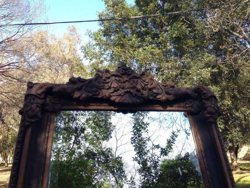 An Ornate Carved Bevelled Mirror