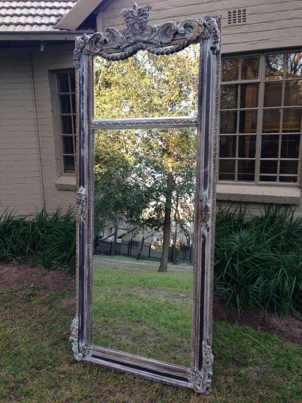 An Ornate Carved & Bevelled Painted Mirror