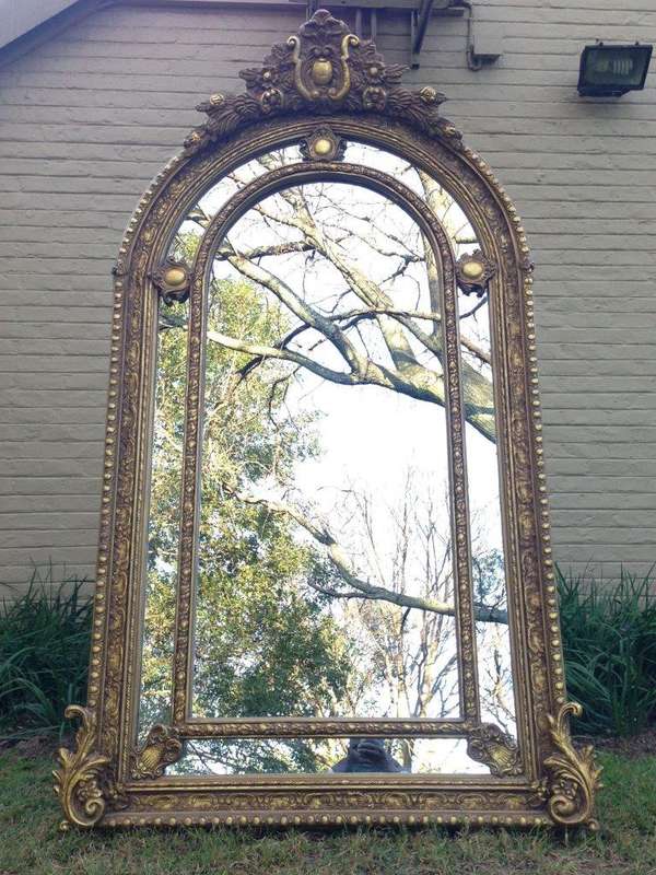 An Ornate Carved Arched Gilded Mirror