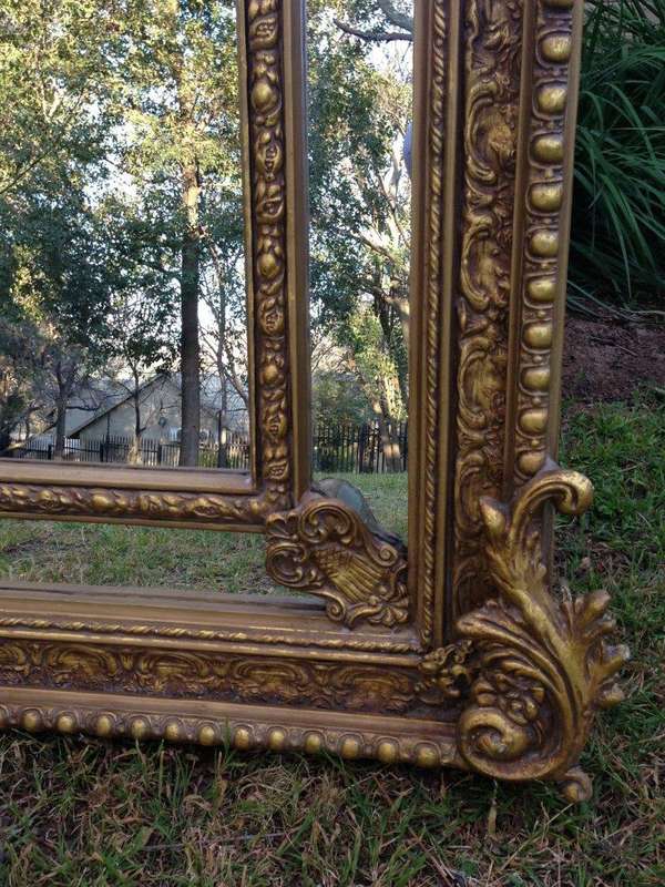 An Ornate Carved Arched Gilded Mirror