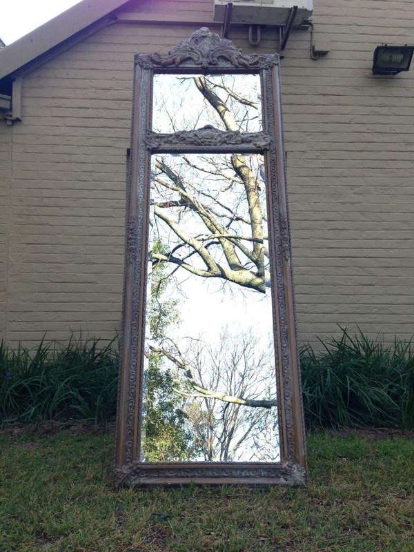 An Ornate Carved & Bevelled Painted Mirror