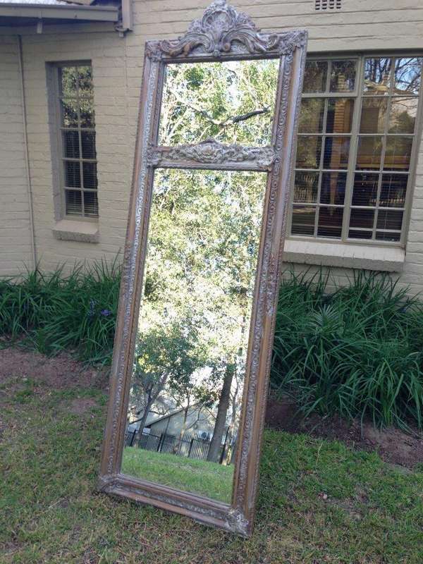 An Ornate Carved & Bevelled Painted Mirror