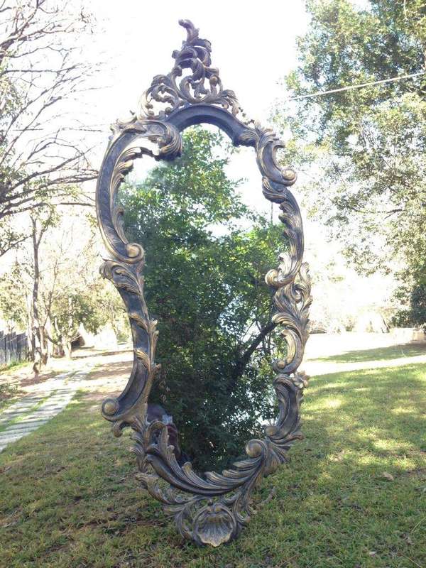 A Pair of Large Ornate Floral Carved Mirrors