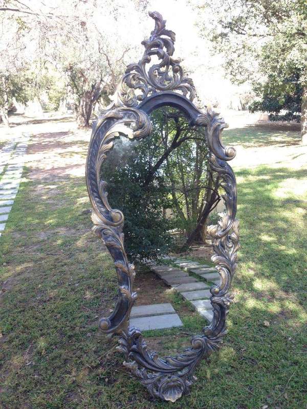 A Pair of Large Ornate Floral Carved Mirrors