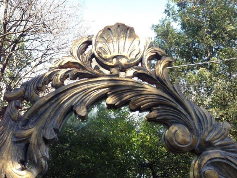 A Pair of Large Ornate Floral Carved Mirrors