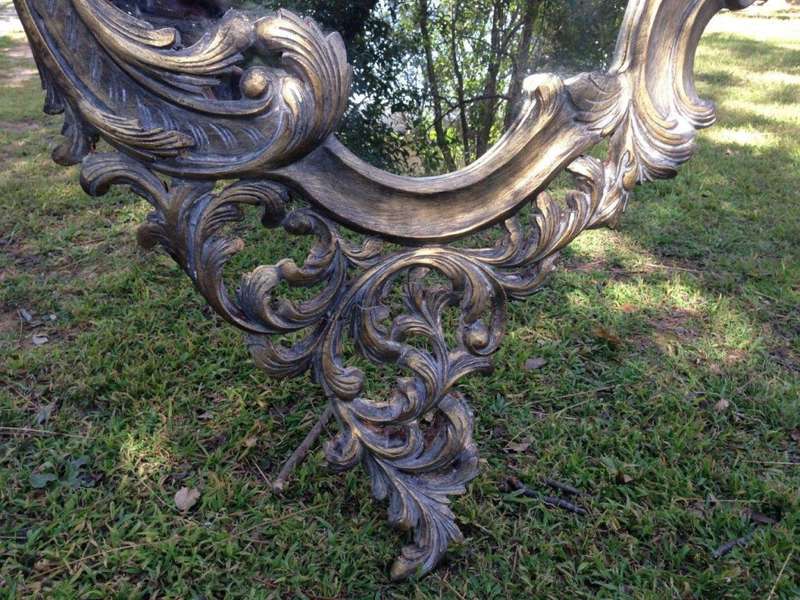 A Pair of Large Ornate Floral Carved Mirrors
