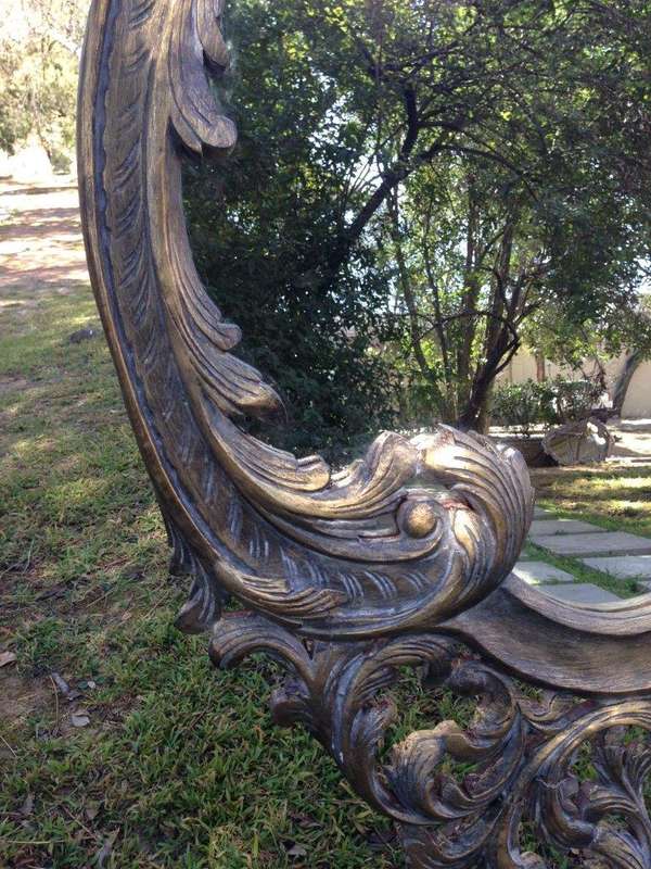 A Pair of Large Ornate Floral Carved Mirrors