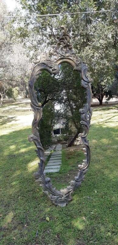 An Extra Large Pair of Ornate Floral Carved Mirror