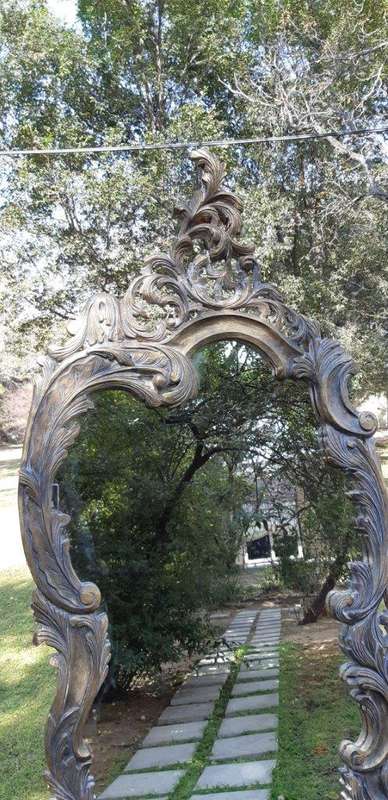 An Extra Large Pair of Ornate Floral Carved Mirror