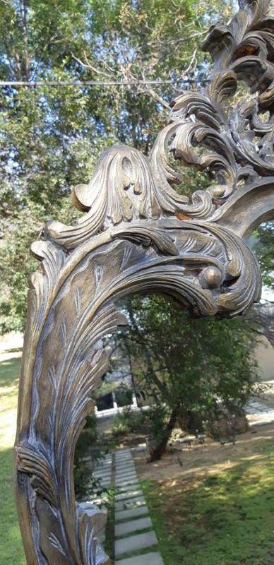 An Extra Large Pair of Ornate Floral Carved Mirror