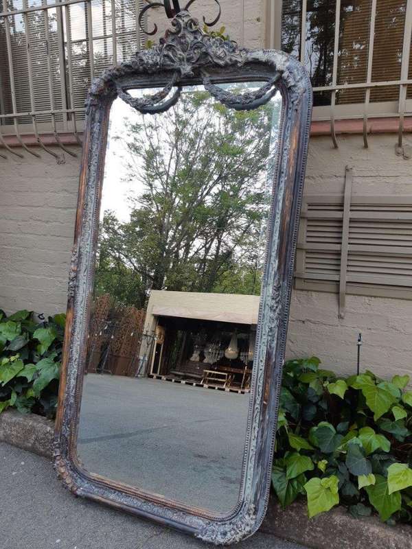 An Ornate Carved & Bevelled Painted Mirror