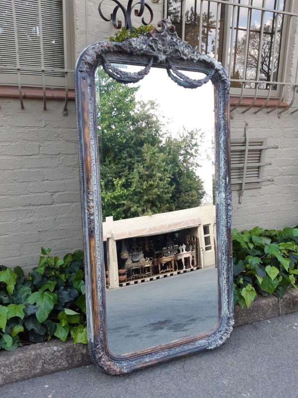 An Ornate Carved & Bevelled Painted Mirror