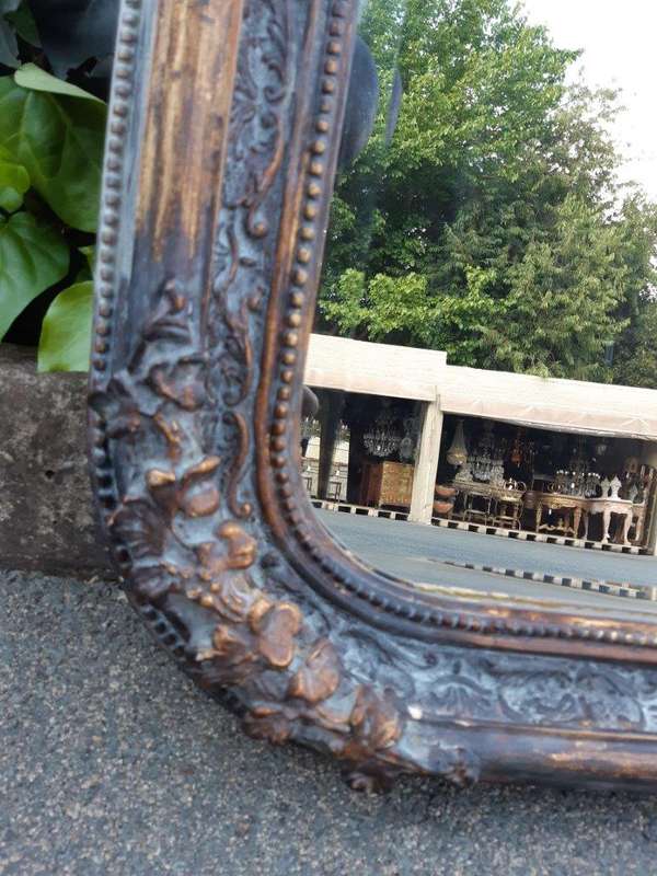 An Ornate Carved & Bevelled Painted Mirror