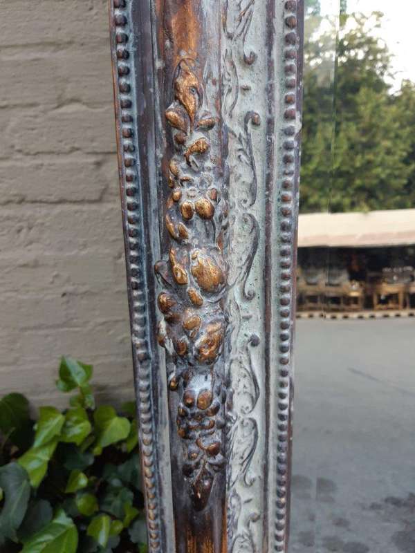 An Ornate Carved & Bevelled Painted Mirror