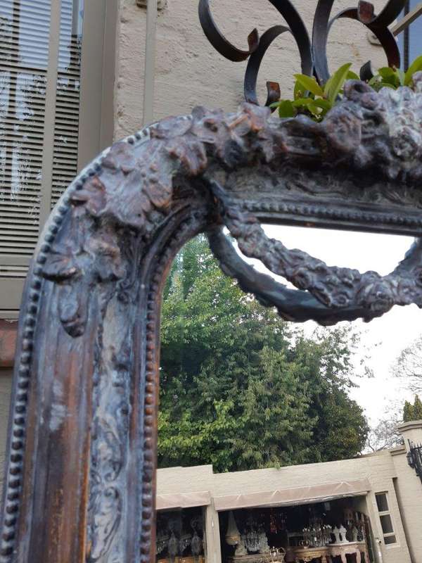 An Ornate Carved & Bevelled Painted Mirror